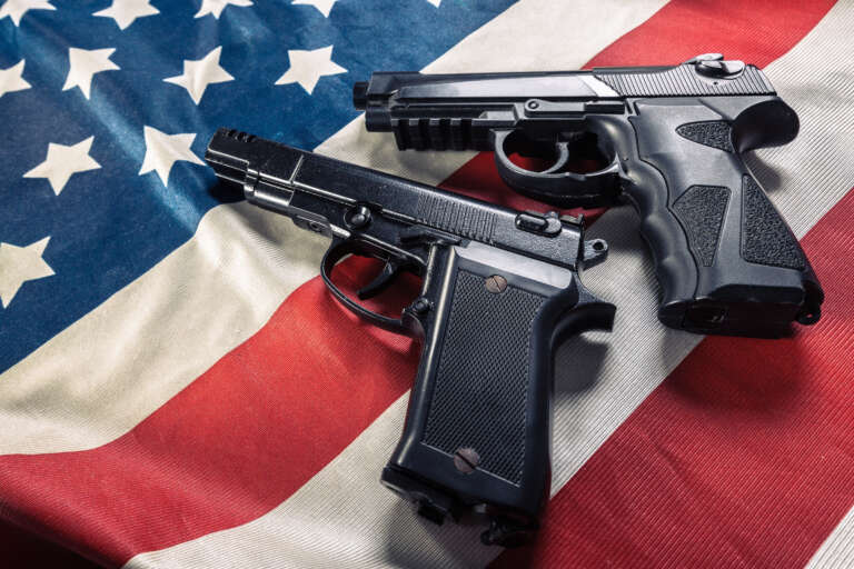 American flag with handgun